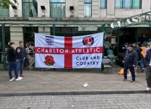 Custom football supporter flag displayed by fans on an away day.